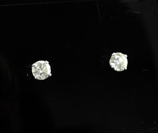A pair of 18ct white gold and solitaire diamond ear studs,